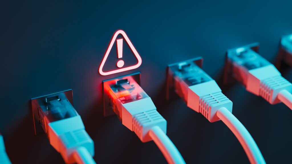 A single point of failure triggered the Amazon outage affecting millions Ethernet cables accompanies by an exclamation points inside a triangle.