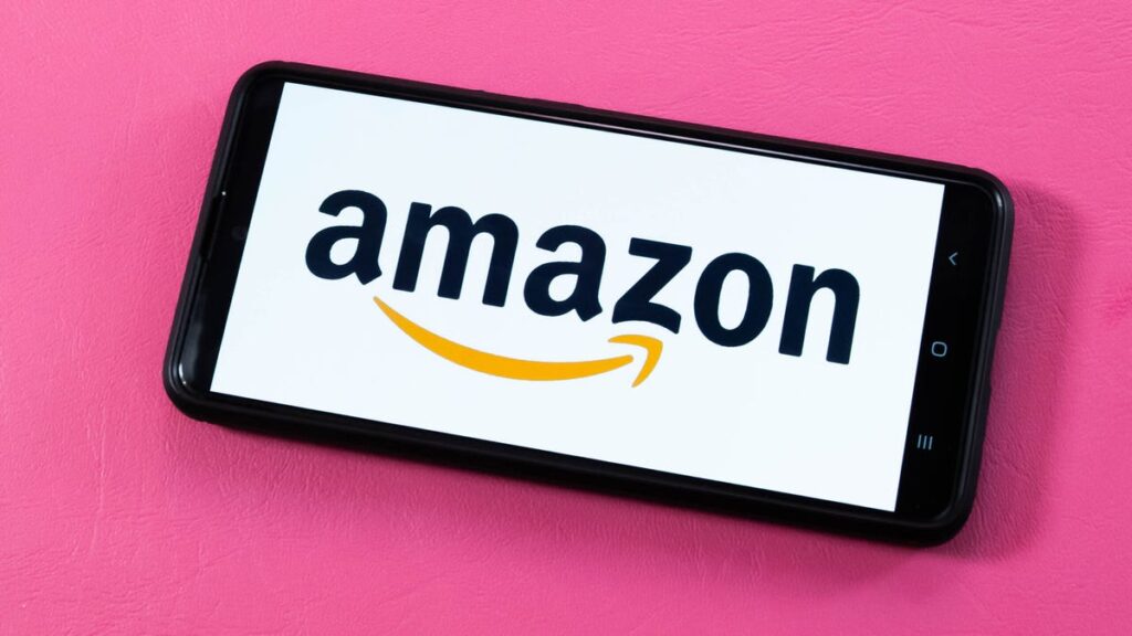 Amazon Slashes 14,000 Jobs as It Leans Into Generative AI Amazon logo on smartphone