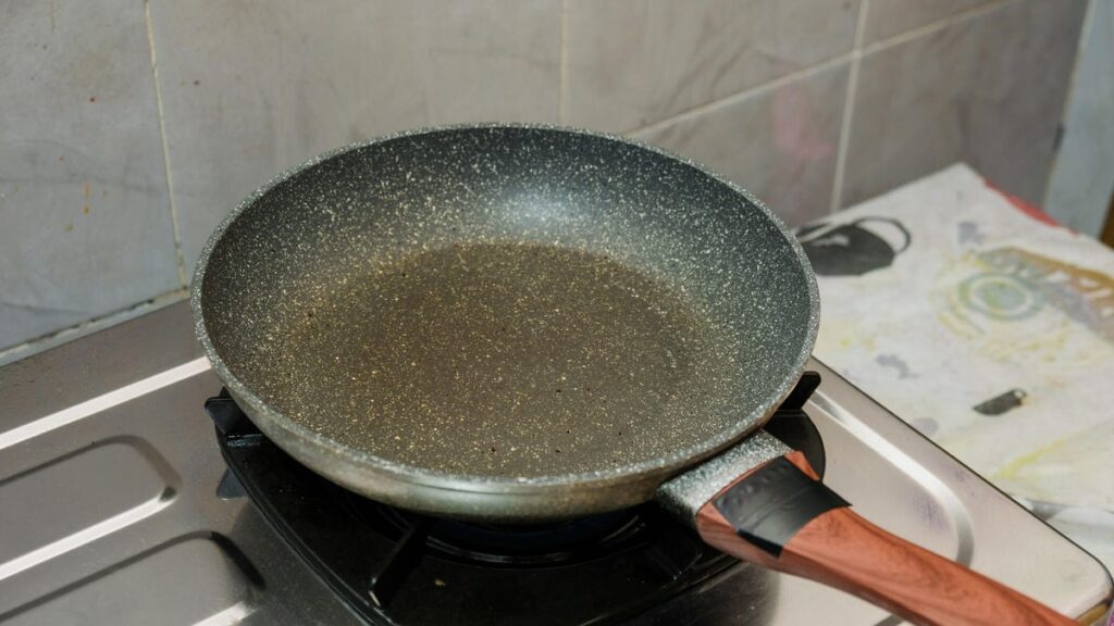 Don’t Even Think About Cooking These 5 Foods in a Nonstick Pan nonstick pan on stove