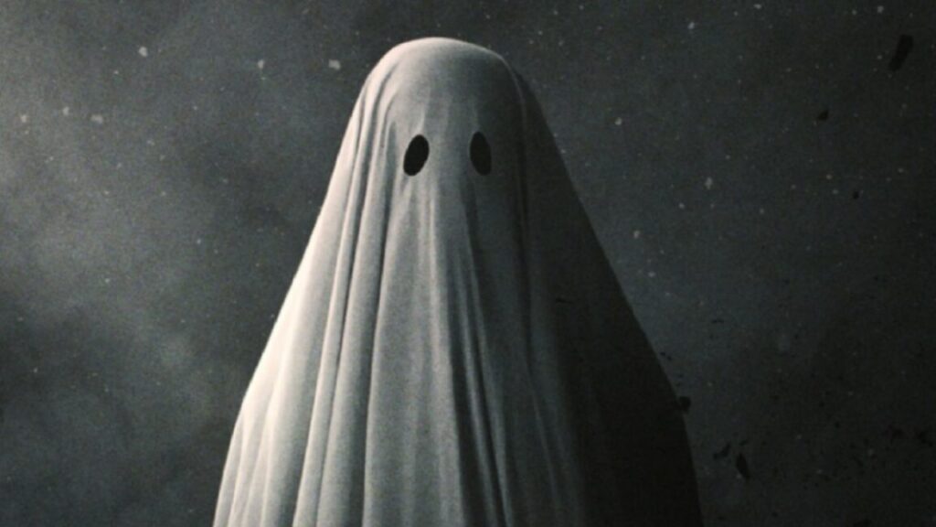 Halloween film fest: 15 classic ghost stories Poster art for 2017 film A Ghost Story featuring a figure draped in a white sheet with eye holes cut out