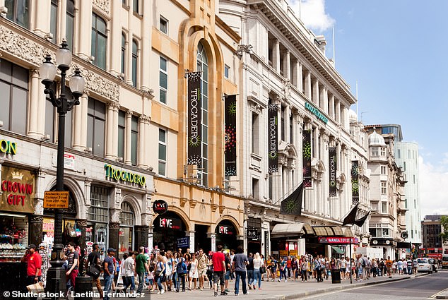 Man, 57, is rushed to hospital after being hit by falling brick in busy tourist hotspot Piccadilly Circus (pictured) is a popular area for tourists in the capital's West End