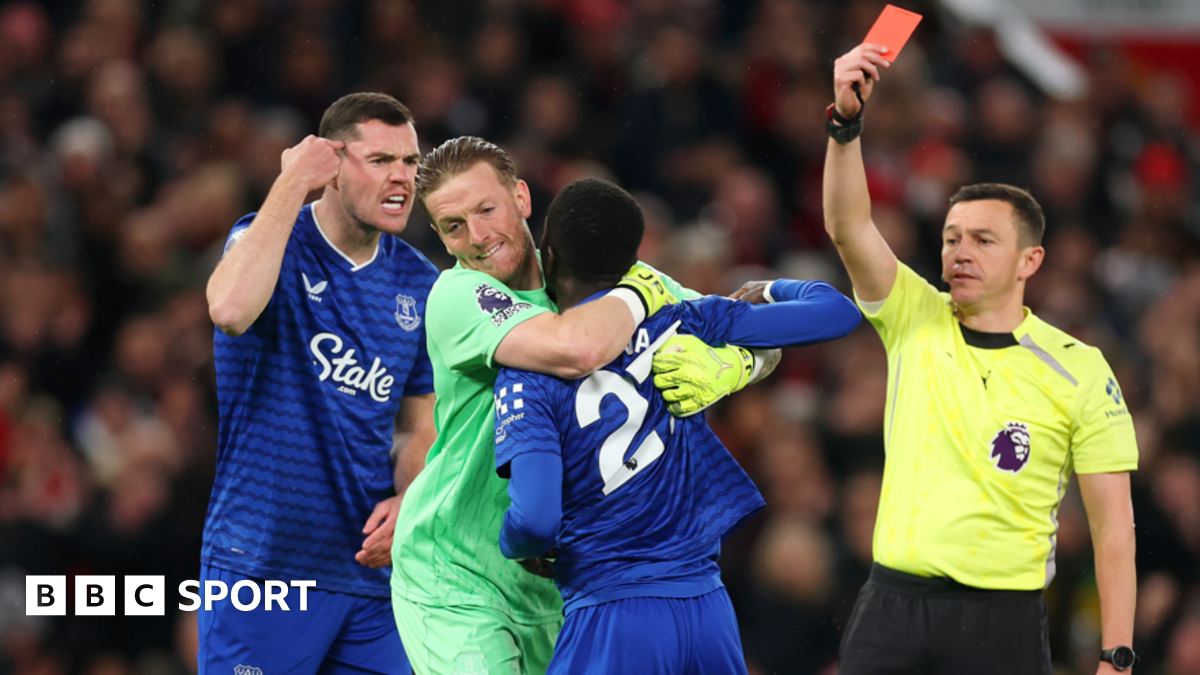 Idrissa Gueye is shown a red card for clashing with Everton team-mate Michael Keane