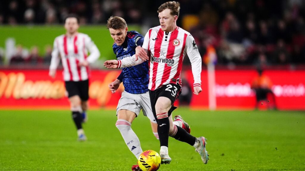 Premier League pitches £750m annual boost from ad sales revamp | Money News Arsenal's Martin Odegaard and Brentford's Keane Lewis-Potter battle for the ball during Thursday's Premier League match. Pic: PA