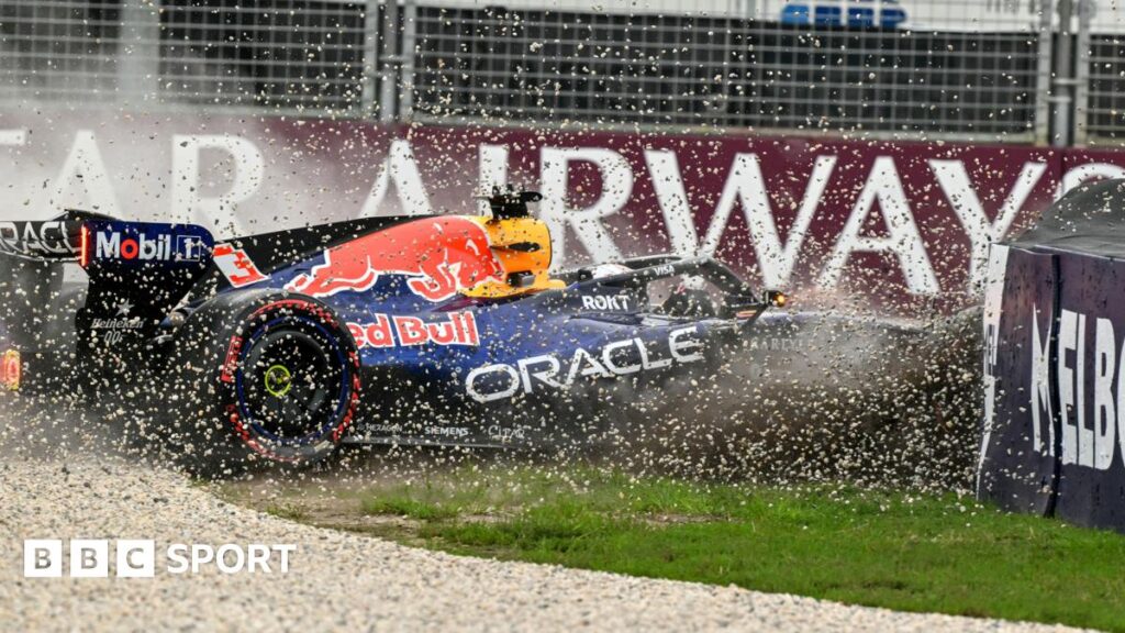 Gravel flies up as Red Bull's Max Verstappen crashes into the barrier as he crashes in qualifying for the Australian Grand Prix