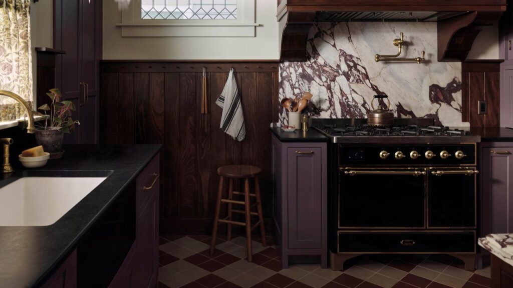 Inside a 1,130-Square-Foot Seattle Cottage With a Purple Kitchen and a Dining Room Library