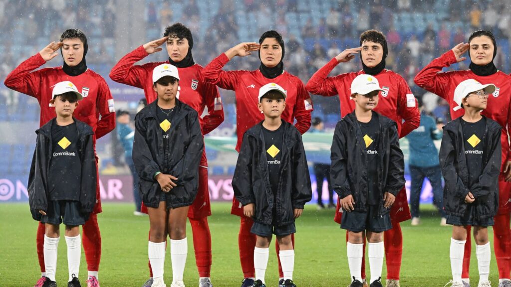 The Iranian team during their national anthem before the match with the Philippines on Sunday. Pic: Dave Hunt/AAP Image via AP