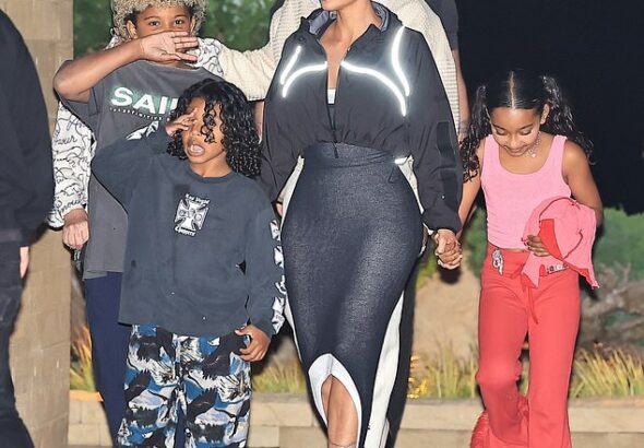 Kim Kardashian took a major step in her blossoming romance with Lewis Hamilton as he spent quality time with her children this week