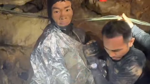 Rescuers free 4 men trapped in flooded cave in Laos, search for 2 still missing