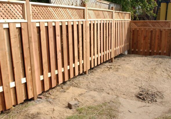 Residents left baffled after privacy fence built just inches from living room window