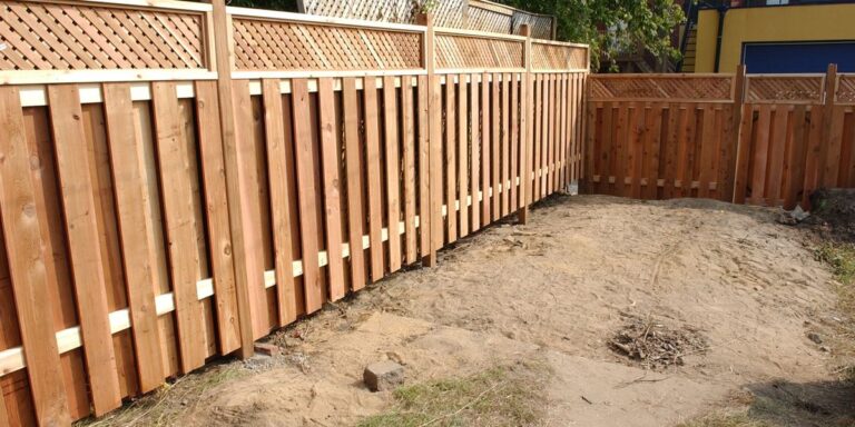 Residents left baffled after privacy fence built just inches from living room window