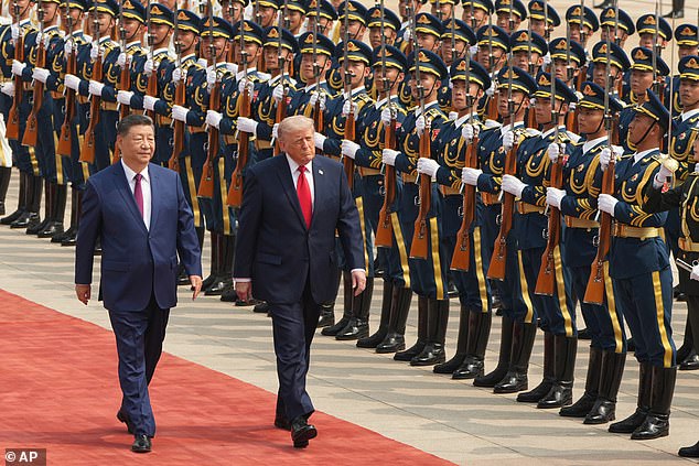 President Donald Trump participates in a welcome ceremony with China's President Xi Jinping at the Great Hall of the People, Thursday, May 14, 2026, in Beijing
