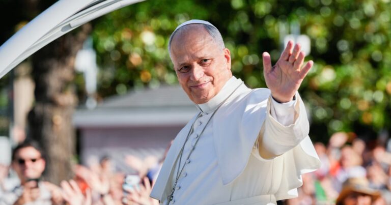 1 million people flood Madrid streets to see the pope’s flower-carpeted procession