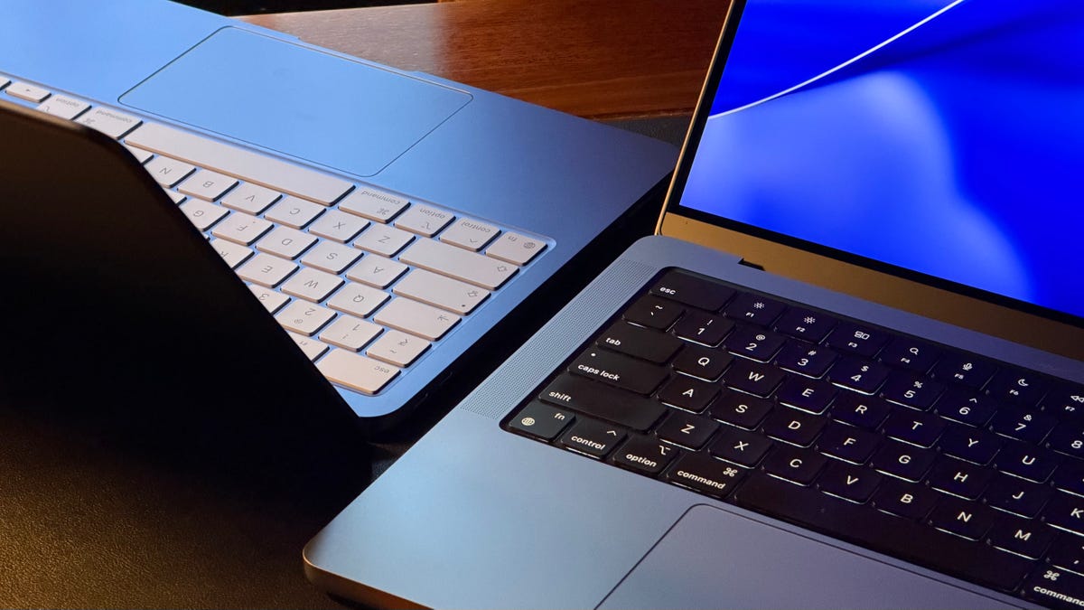 MacBook Neo and MacBook Pro kept next to each other on a table