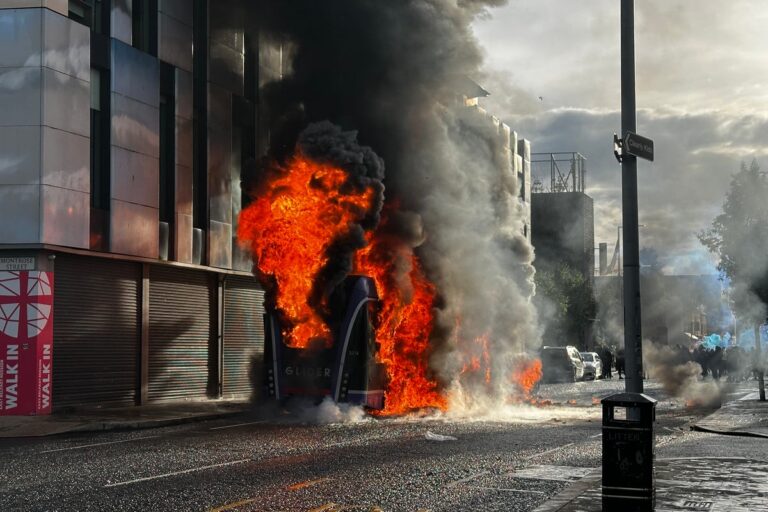 Belfast stabbing latest: Protesters set bus on fire as man charged with attempted murder