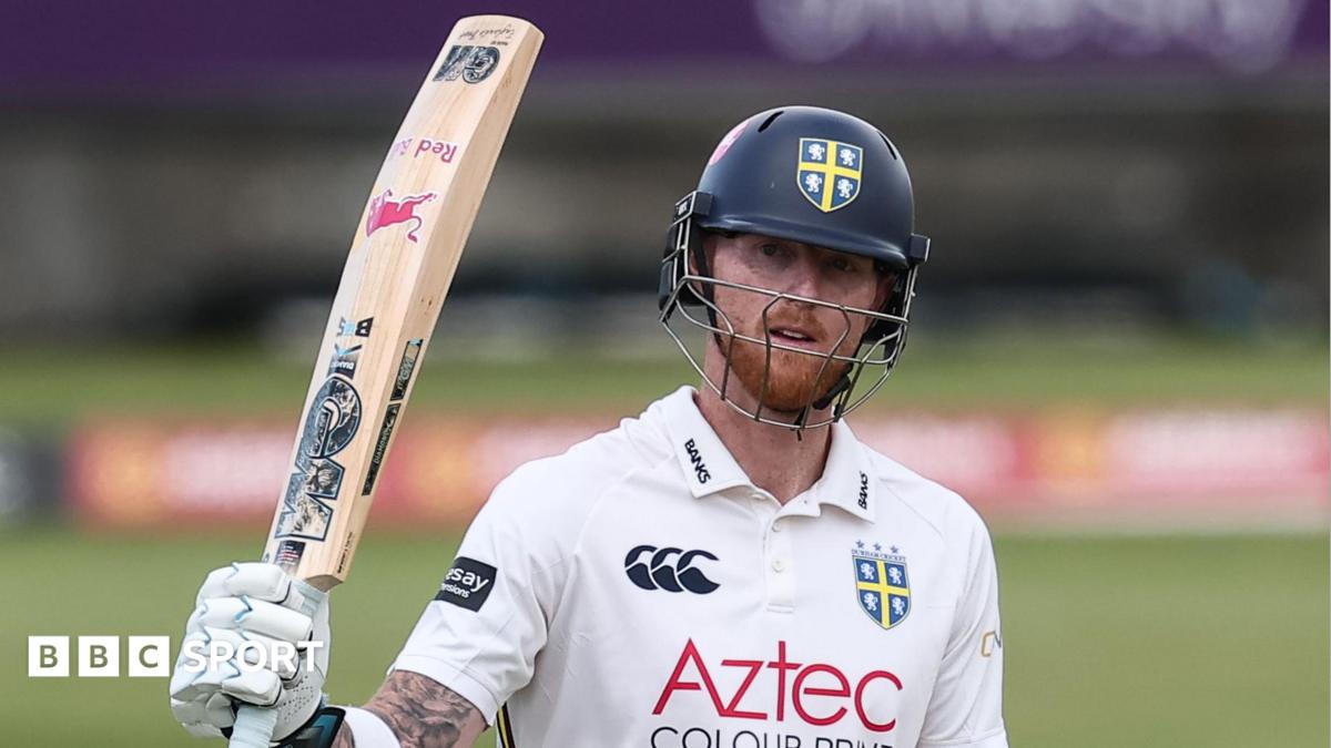 Ben Stokes, wearing a Durham batting helmet, raises his bat