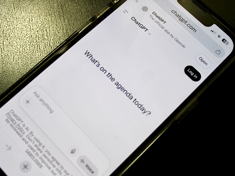 A phone screen shows the ChatGPT home page.