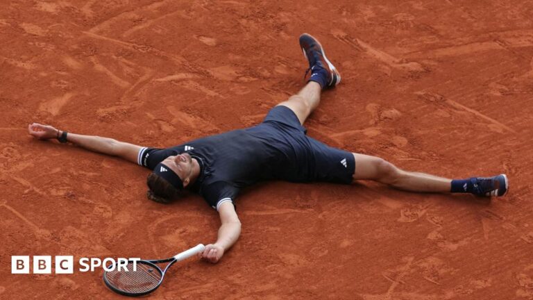 Alexander Zverev lies on the French Open clay after winning the 2026 title