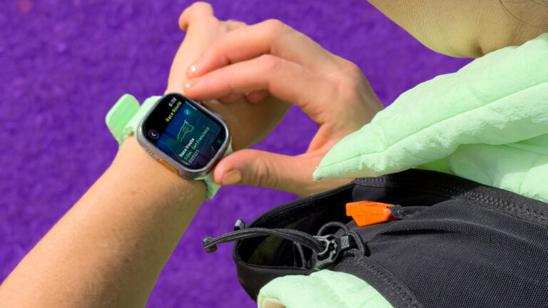 A person readies their Apple watch for a workout.