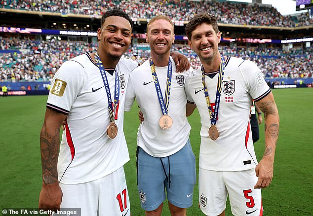 England players called over reserve goalkeeper Jason Steele (centre) to collect a bronze medal after the win against France