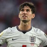 John Stones wearing an England shirt
