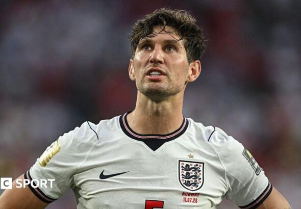 John Stones wearing an England shirt