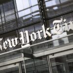 The New York Times logo above the doors of the news organization's building in New York City.
