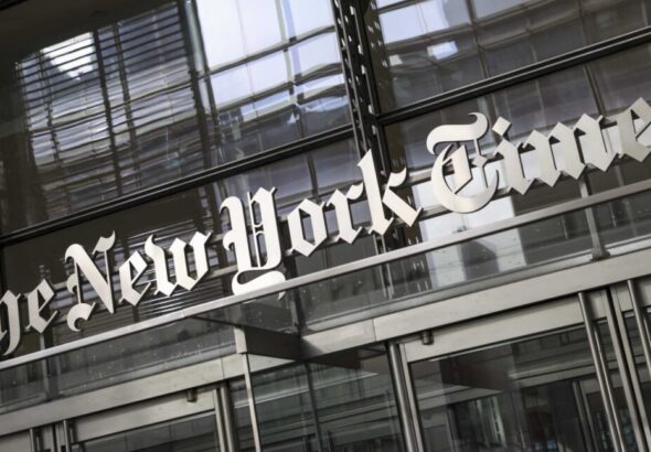 The New York Times logo above the doors of the news organization's building in New York City.