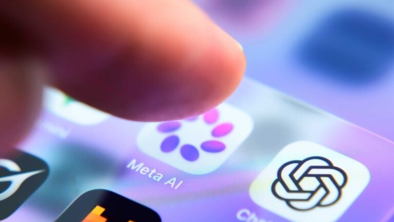 A person's finger hovers over a smartphone app icon for the Meta AI app