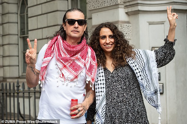 Huda Ammori (right) with Palestine Action co-founder Richard Barnard, pictured in 2024, has been granted the green light to challenge the group's prohibition in the Supreme Court