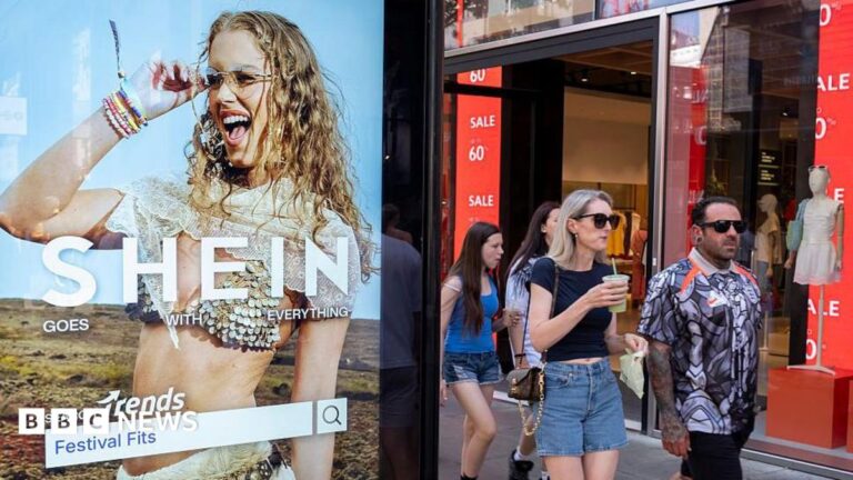 Peolep walking past a bus stop advertising for Chinese e-commerce fashion company Shein on 11 July 2026 in London.