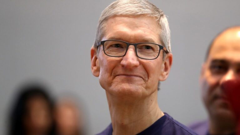 A smiling man in glasses and a tee-shirt.