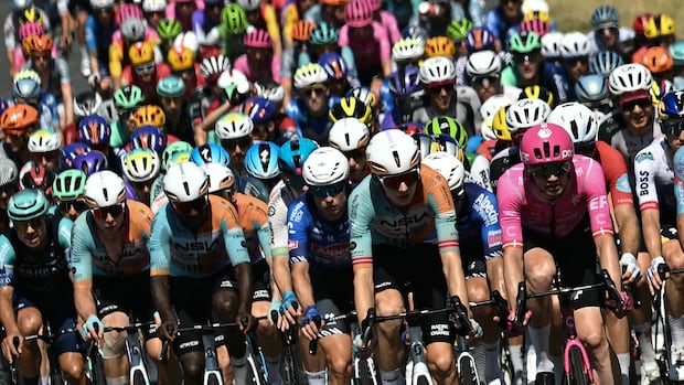 Tour de France cyclists battle 4-time champion Tadej Pogačar — and intense heat
