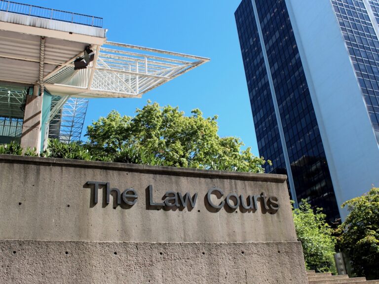 A concrete building built in the 1980s in downtown Vancouver, with the words ‘The Law Courts.’