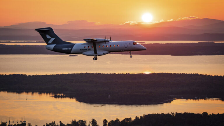 Heart Aerospace's X1 demonstrator aircraft flies over lakes and forest set against the rising sun near Plattsburgh International Airport in upstate New York on August 12.