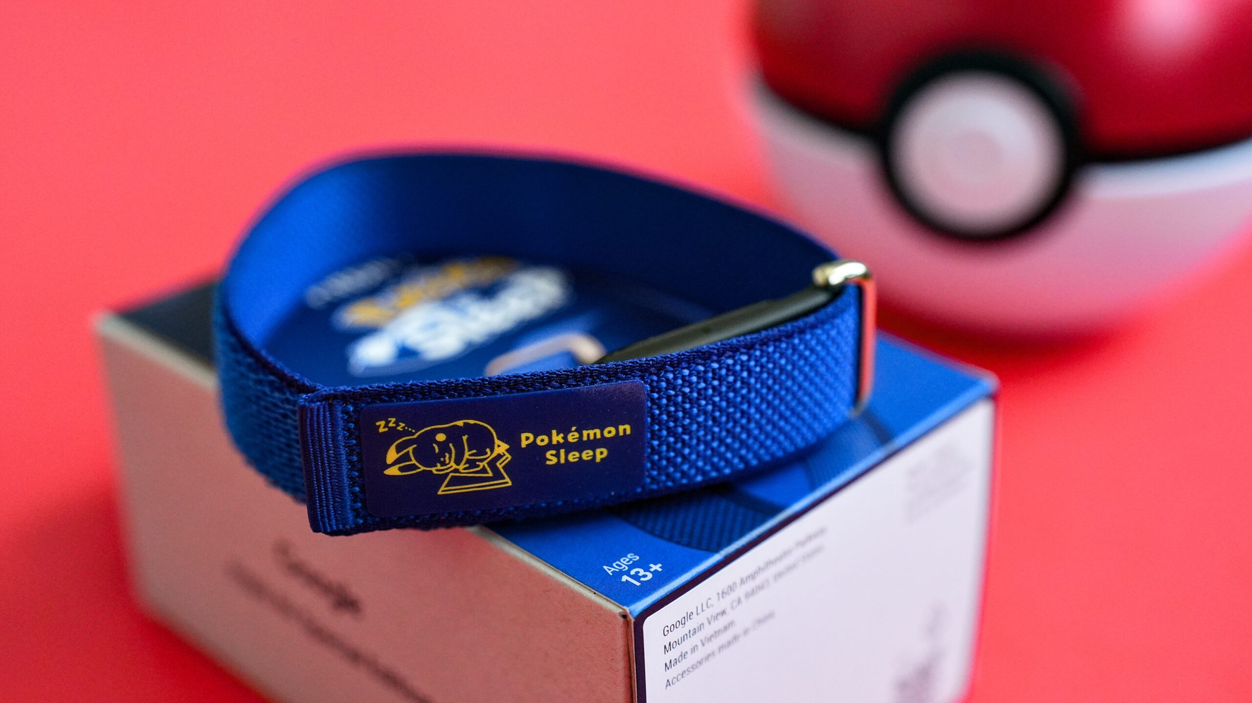 The special edition Fitbit Air on top of a box.
