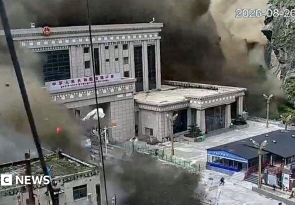 CCTV shows people running as mud and water destroys buildings in Gyirong, Tibet