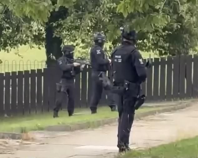 Armed police on the scene of a suspected knife attack in Eston near Middlesbrough today
