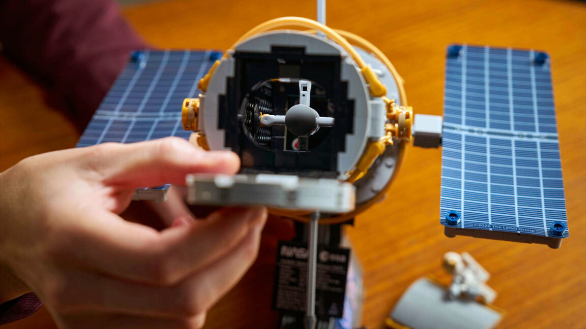 a photo of a toy brick-built space telescope from the vantage point of looking through the open aperture door.