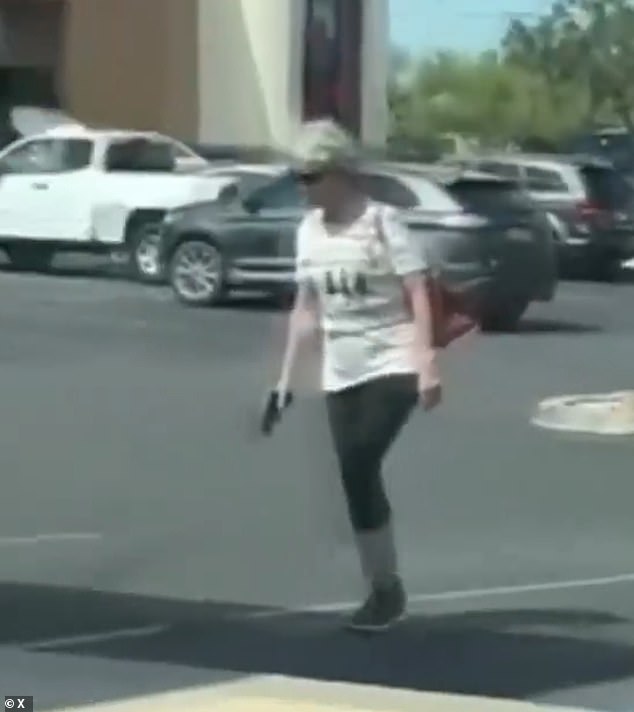 Moment Arizona grandmother pulls a GUN on alleged shoplifter while confronting him during tense parking lot standoff