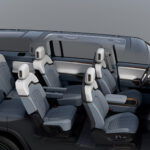 Render of Rivian R1S (2027) interior cut away to show the new second-row captain's chairs
