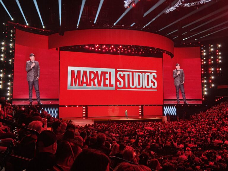 crowd watching Marvel Studios announcement in red