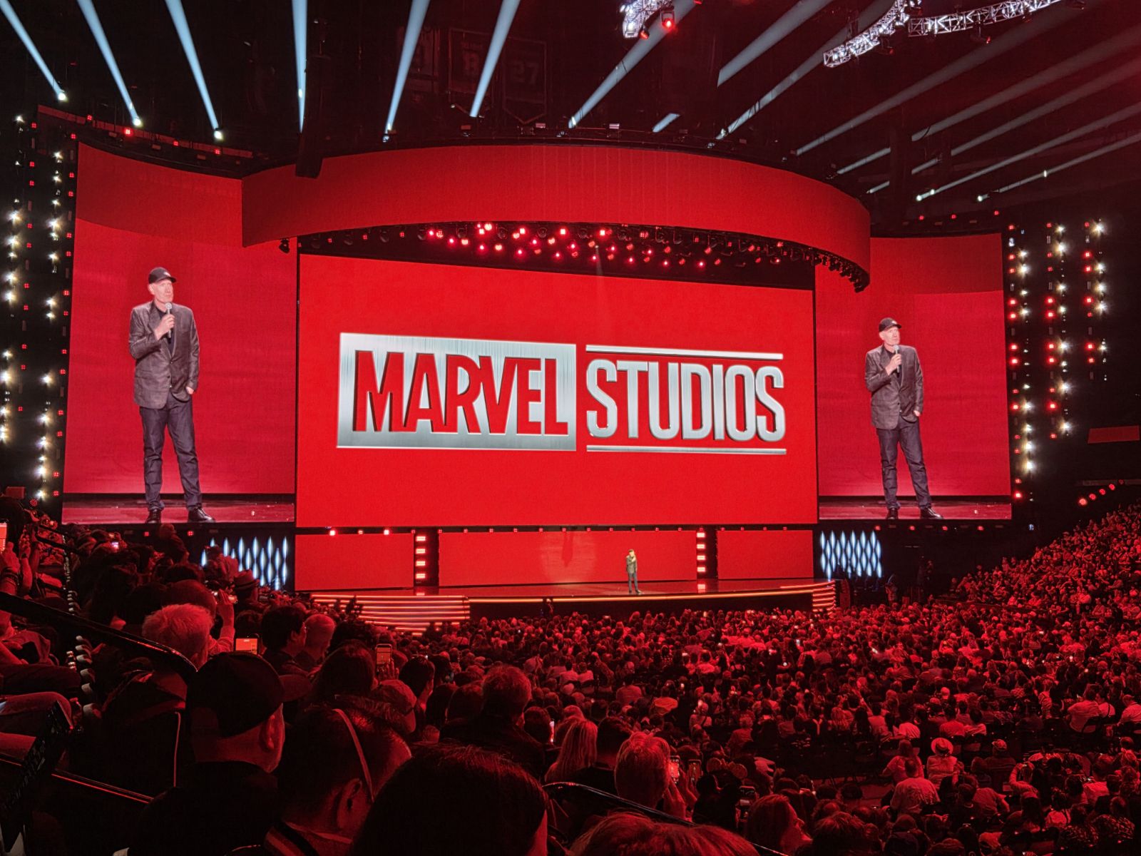 crowd watching Marvel Studios announcement in red