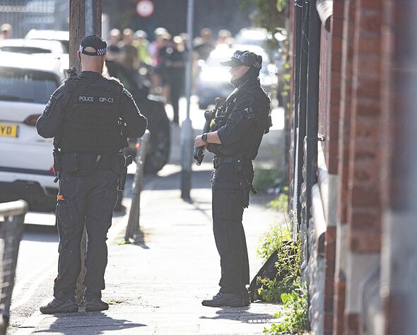 Armed police swarm Bristol street and school locked down as 'man seen with weapon'