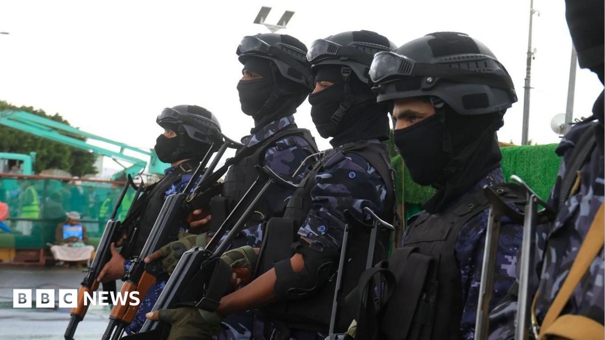 Houthi troopers stand guard during a protest against Saudi Arabia, in Sana'a, Yemen.
