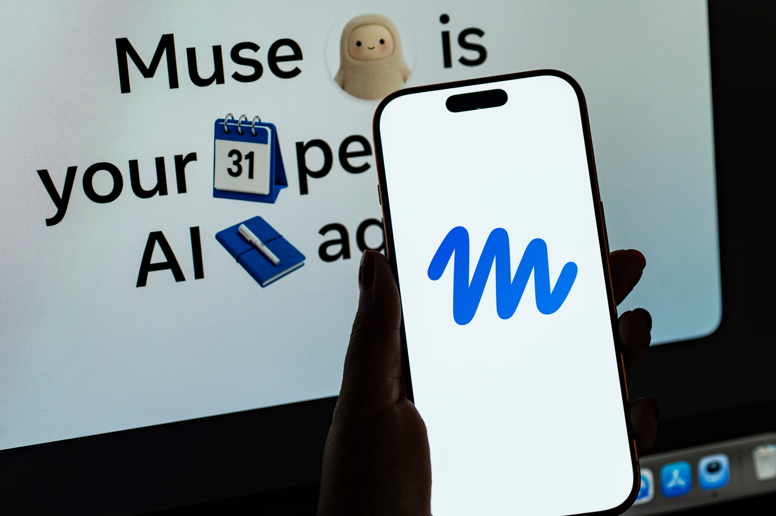 In this photo illustration, a person holds a smartphone displaying the logo of Muse, Meta’s personal AI agent