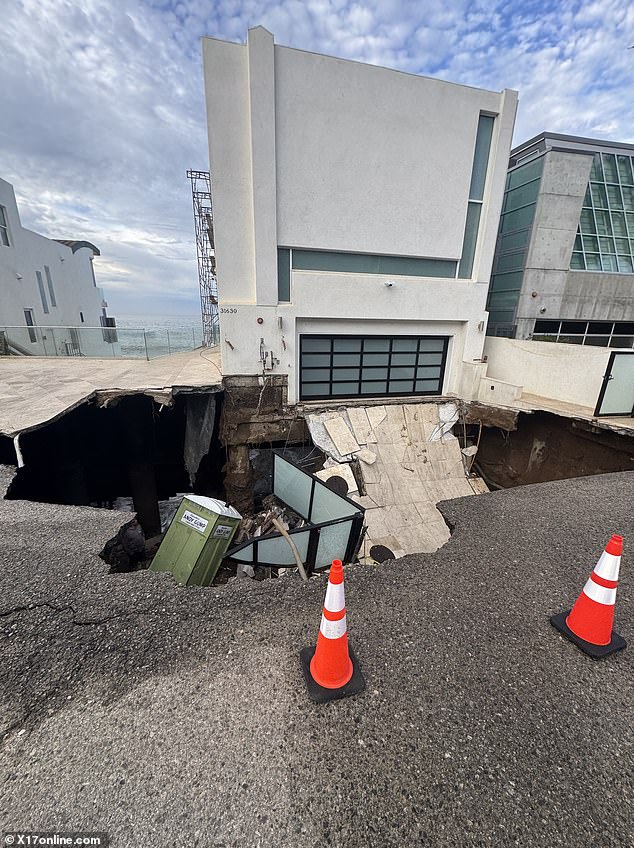 Nicolas Cage's Malibu neighbors have been instructed to evacuate their homes as a result of the massive sinkhole that opened on his street and swallowed up his driveway