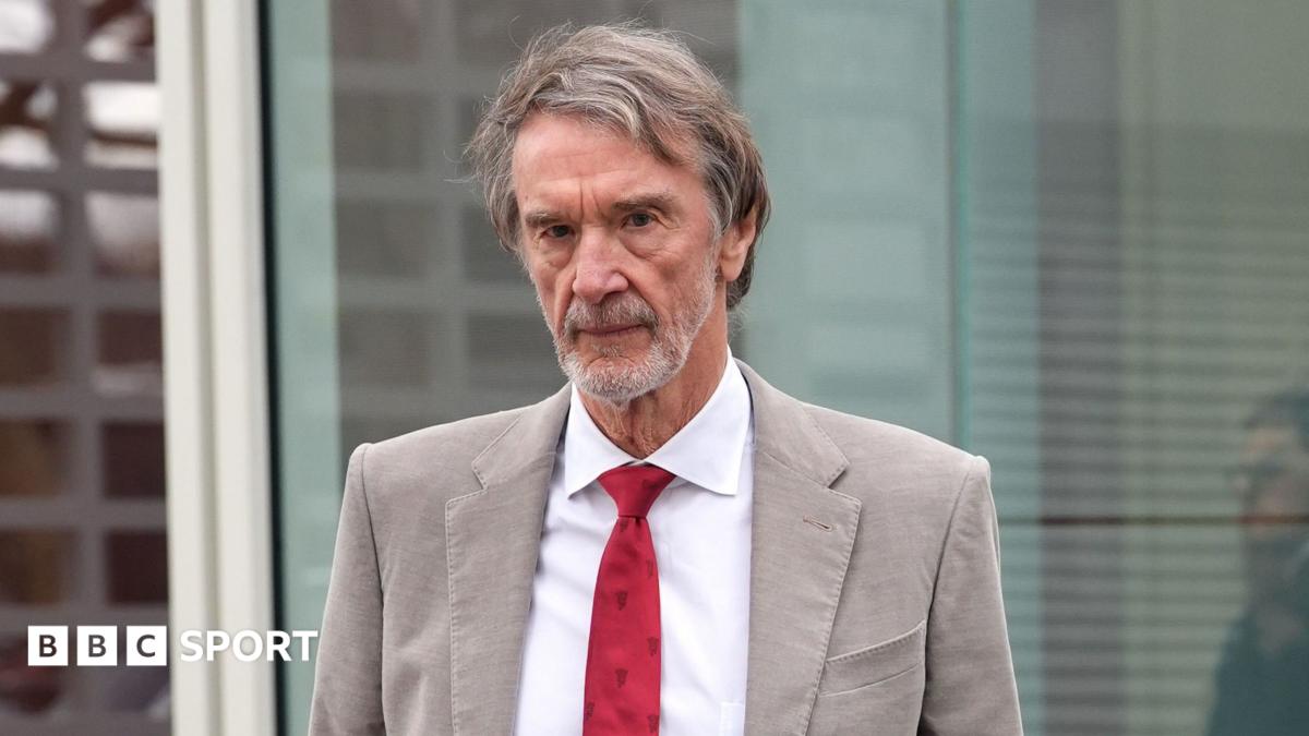 Sir Jim Ratcliffe in light-coloured smart jacket, white shirt and red tie