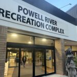 The exterior of the Powell River Recreation Complex at dusk.
