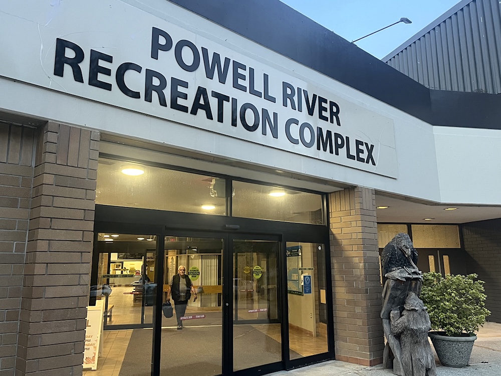 The exterior of the Powell River Recreation Complex at dusk.