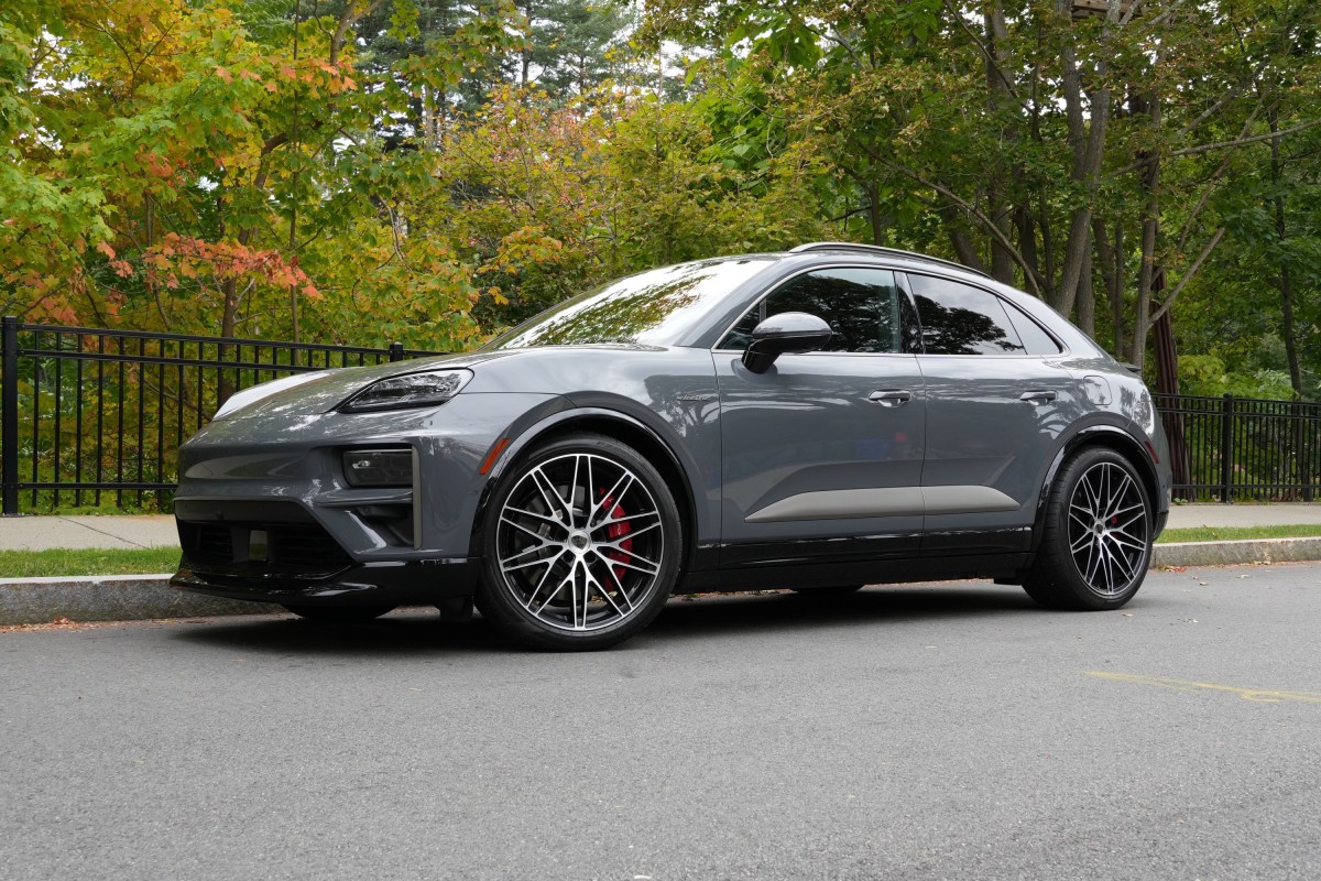 A Porsche Macan Turbo sits parked on the street.